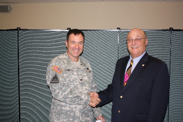 Mitch Able (r), chapter president, thanks Col. Powell for his speech at the June luncheon.